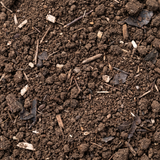 Close-up van de structuur van groencompost met zichtbare houtvezels