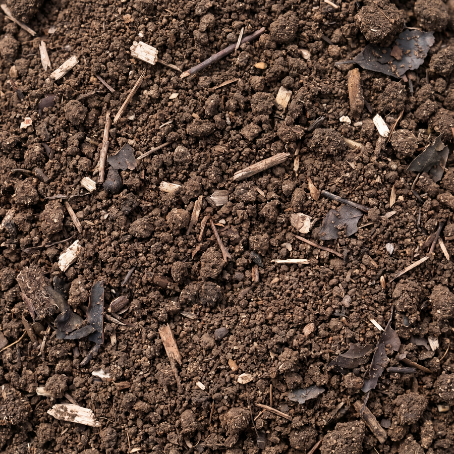 Close-up van de structuur van groencompost met zichtbare houtvezels